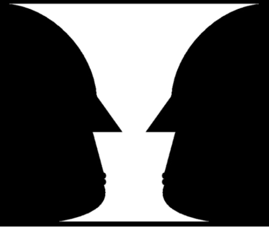 An illustration shows two identical black face-like shapes that face towards one another, and one white vase-like shape that occupies all of the space in between them. Depending on which part of the illustration is focused on, either the black shapes or the white shape may appear to be the object of the illustration, leaving the other(s) perceived as negative space.