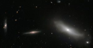 A group of galaxies with different shapes and sizes.
