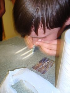 Man snorting cocaine