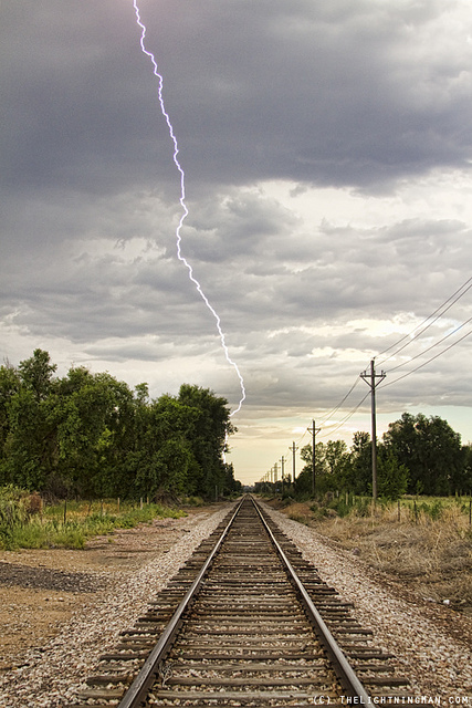 We know that the tracks at right are parallel. When they appear closer together, we determine they are farther away.