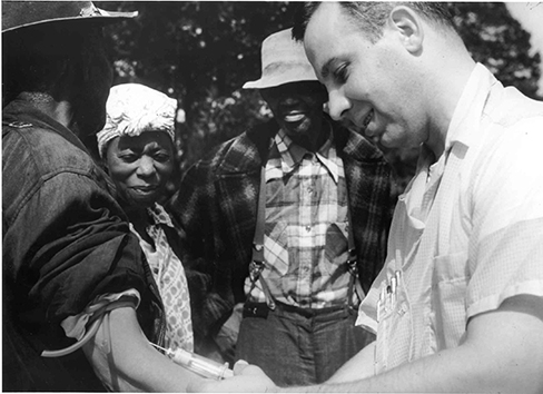 Tuskegee participants being injected by a White doctor