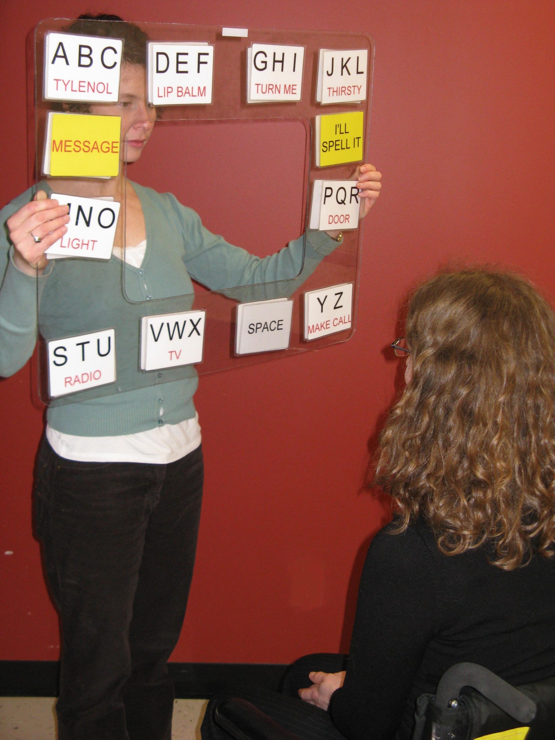 A woman holding a visual aid for a presentation