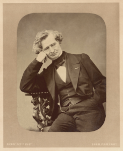 Photograph of Hector Berlioz, seated, resting his head on his hand