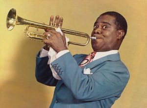 Photograph of Louis Armstrong playing trumpet