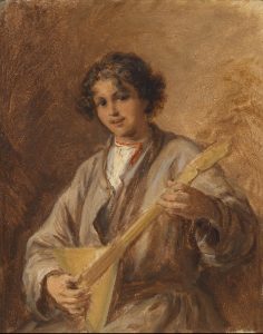 A portrait of a boy holding a Russian string instrument balalaika
