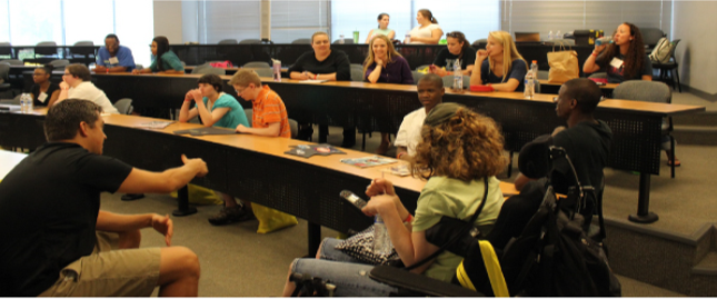 A photograph shows students in a classroom.