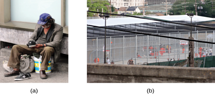 Photograph A shows a person sitting on a bucket, leaning on the side of a building. A bag of belongings are at his feet. He holds a sneaker and the other one is on the ground in front of him. Photograph B shows a prison yard from afar. There are several people gathered around a basketball court.