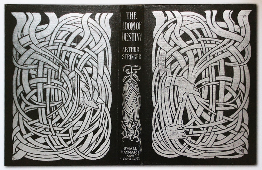 silver embossed book cover of elaborate weaving